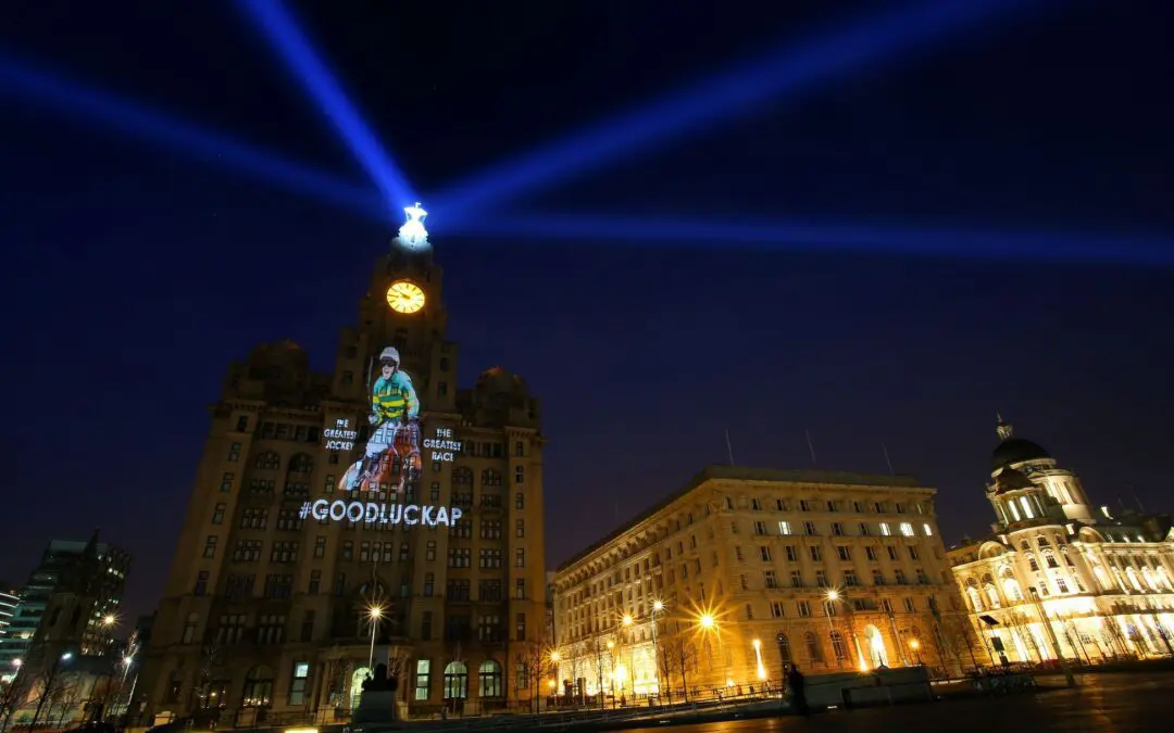 Projection of AP McCoy looks over Liverpool from the Liver Building – Liverpool Echo
